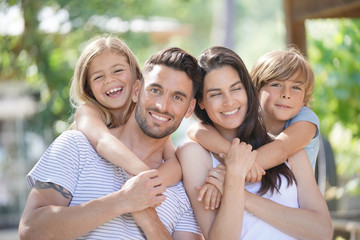 Obraz premium Portrait of happy family on summer day