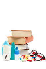 Stack of books and pills, capsules. Medicaments.