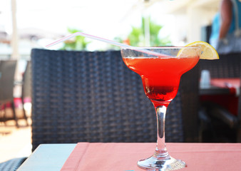 margarita cocktail in a glass on a background of bright lights.