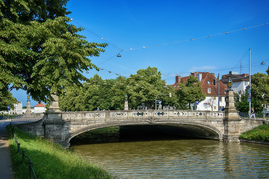 Munich, Germany - June 09, 2018: Historic stone bridge and canal, Munich, Germany