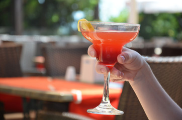 margarita cocktail in a glass on a background of bright lights.