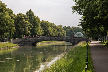 Munich, Germany - June 09, 2018: Historic stone bridge and canal, Munich, Germany