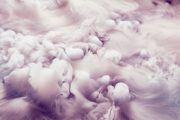 Abstract background of clouds made of smoke from dry ice in color pink