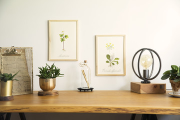 Vintage, creative home office interior with wooden desk, notebooks, romantic illustrations of...