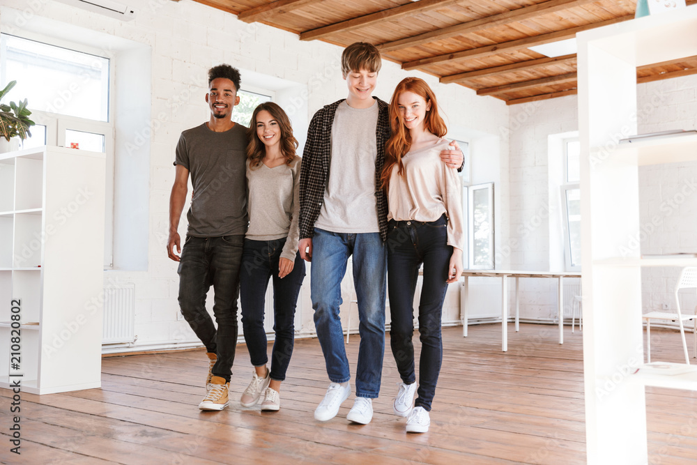 Canvas Prints Cheerful friends students walking in classroom