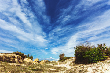 Mountain climbing across the hills in the place called The End of The World nearby local fishermen and kitesurfing village Mui Ne in Vietnam. 