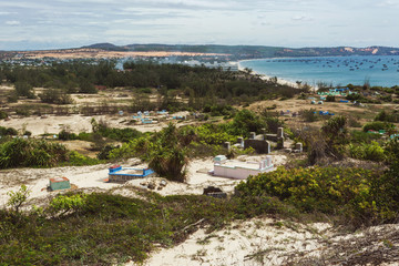 Local cemetery ontop of the hills in the place called The End of The World nearby local fishermen and kitesurfing village Mui Ne in Vietnam. 