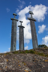 Three large viking swords stand on the hill as a memory to the Battle of Hafrsfjord in year 872 in Stavanger. Symbol of Stavanger, Norway.