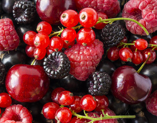 Ripe blackberries, blackcurrants, cherries, red currants and raspberries. Mix berries and fruits. Top view. Background berries and fruits. 