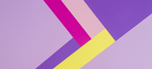 Color papers geometry flat composition background with violet, purple, pink, rose, yellow tones.