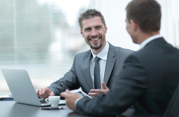 closeup.business colleagues sitting at a Desk.