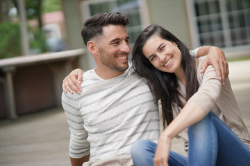 Fototapeta premium Couple relaxing in yard, embracing each other
