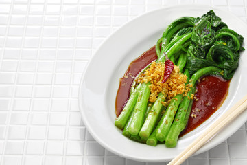choy sum stir fry with oyster sauce and garlic, chinese cuisine