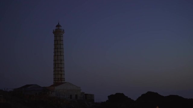 Ustica's lighthouse during a summer sunset
