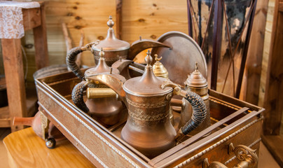 antique arabic coffee pots in metal sandbox