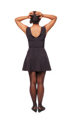 Back view of shocked black woman in blue jeans shorts. girl hid his eyes behind his hands.