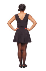 Naklejka premium Back view of an African-American woman in a brown dress.