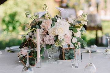 Composition from flowers - decoration of a table for guests.