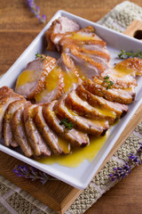 Sliced duck breast with orange sauce and thyme. Duck breast fillets steak