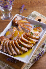 Sliced duck breast with orange sauce and thyme. Duck breast fillets steak