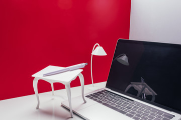 real size laptop with toy table and lamp in miniature room