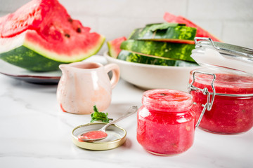 Homemade sweet watermelon jam, white marble background copy space