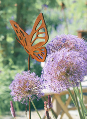 Iron decoration on a flower bed © 7monarda