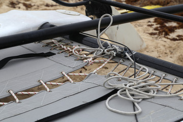 Rope-bound tarpaulin on a catamaran