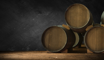 Beer barrel with beer glass on table on wooden background