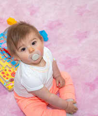 Fototapeta premium Baby girl on the floor