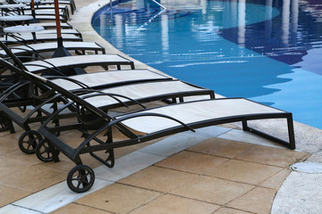 Sun beds at the edge of the pool