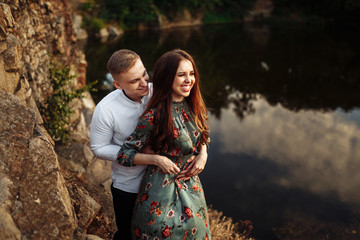 Couple in love celebrating anniversary on the rock