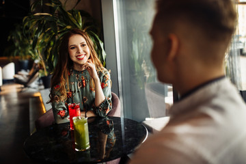 Two lovers posing on the restaurant