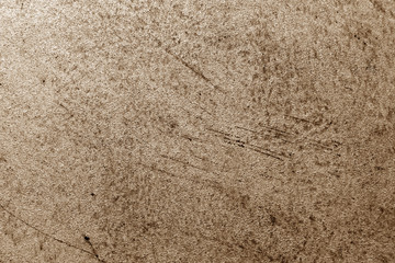 Grungy cement wall in brown color.
