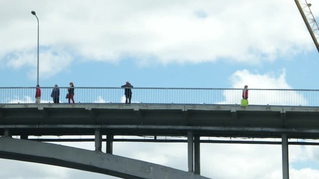 People on the bridge through Dnieper River, Kiev, Ukraine