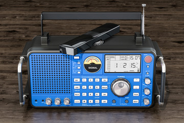 Modern digital radio on the wooden table, 3D rendering