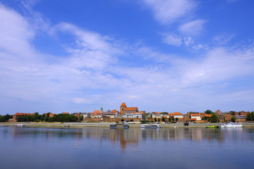 Naklejka na ściany i meble Torun, Poland - Panoramic view of historical district of Torun old town by the Vistula river