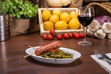 Two sausages and broccoli