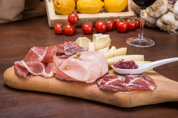 Salami and cheese plate on italian table