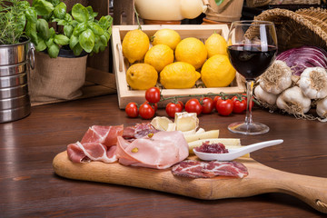 Salami and cheese plate on italian table