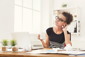 Obraz premium Tired, overworking businesswoman modern office