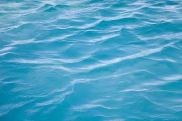 Blue sea ocean water background .Tropical Pattern blue ripple curl water in swimming pool .