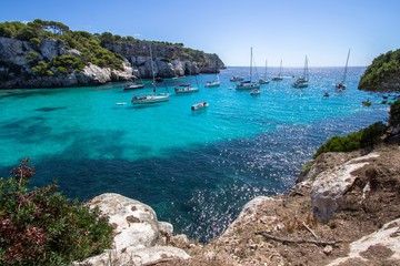 Boats and yachts on Macarella beach, Menorca, Spain