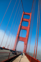 San Francisco Golden Gate bridge traffic on foggy day dramatic evening light