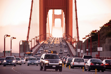 San Francisco Golden Gate bridge traffic on foggy day dramatic evening light