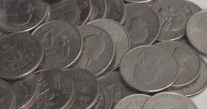 Pile Of Quarters On White Background Rotating