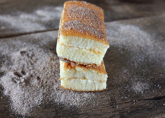 fresh sweet homemade delicious cake on wooden background