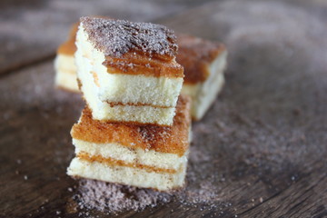 fresh sweet homemade delicious cake on wooden background