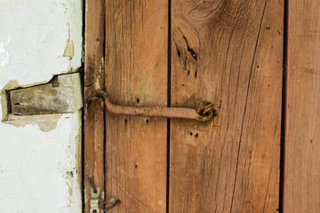 Rough wooden vertical planks background. Old rustic texture of the door.