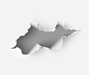 Hole torn in ripped paper on white